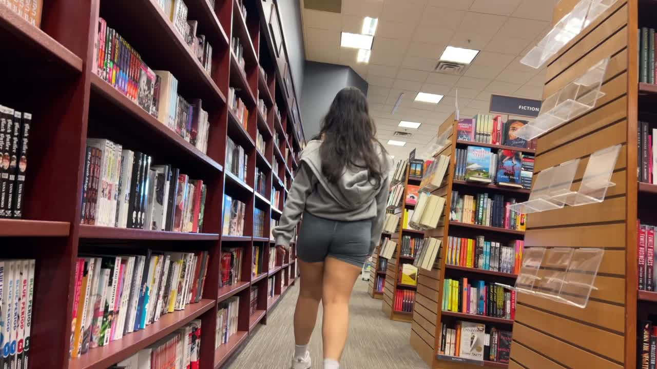 blonde_white_girl_in_library_squatting_down_gis
