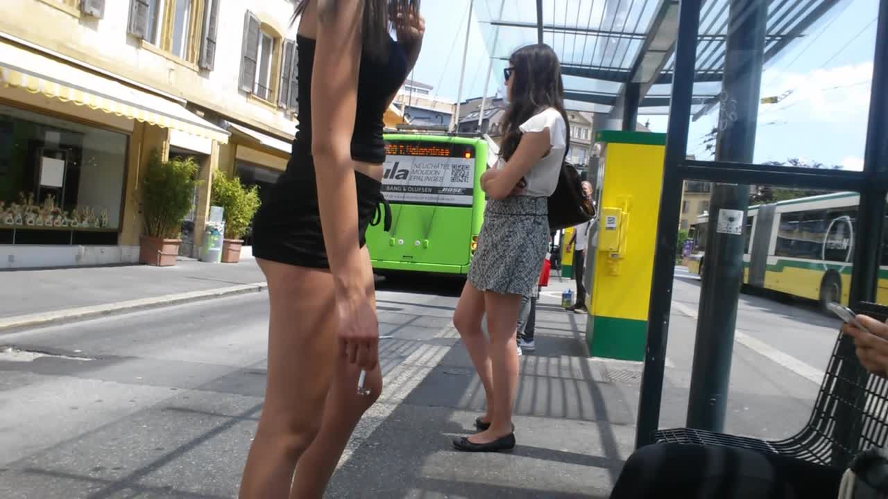 white_girl_brunette_in_black_shorts_at_busstop_gis